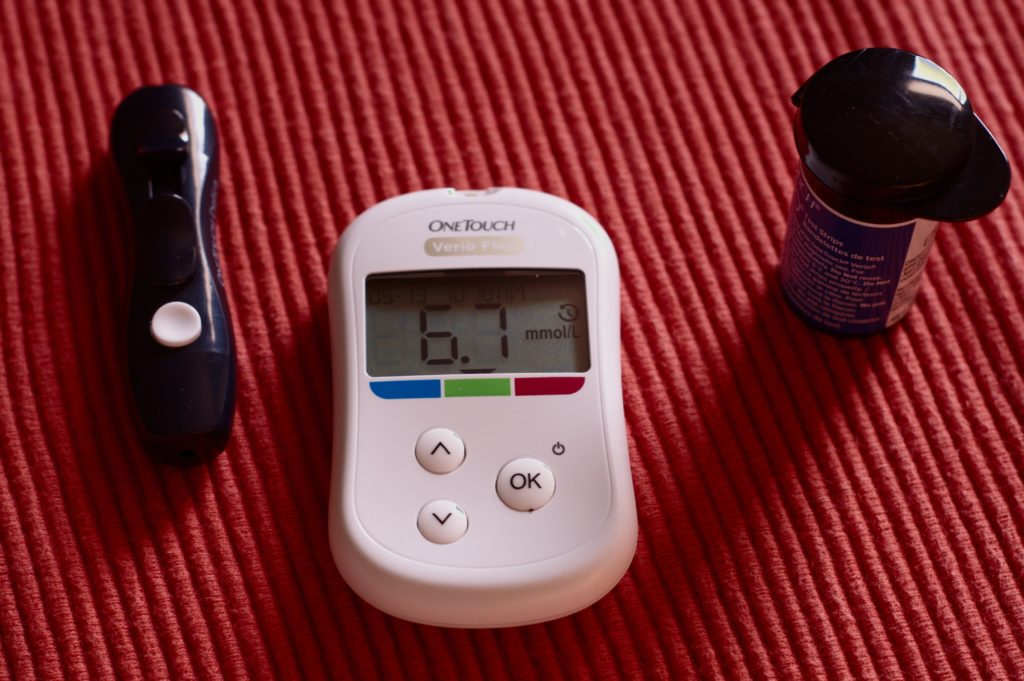 diabetes-monitor-on-red-background