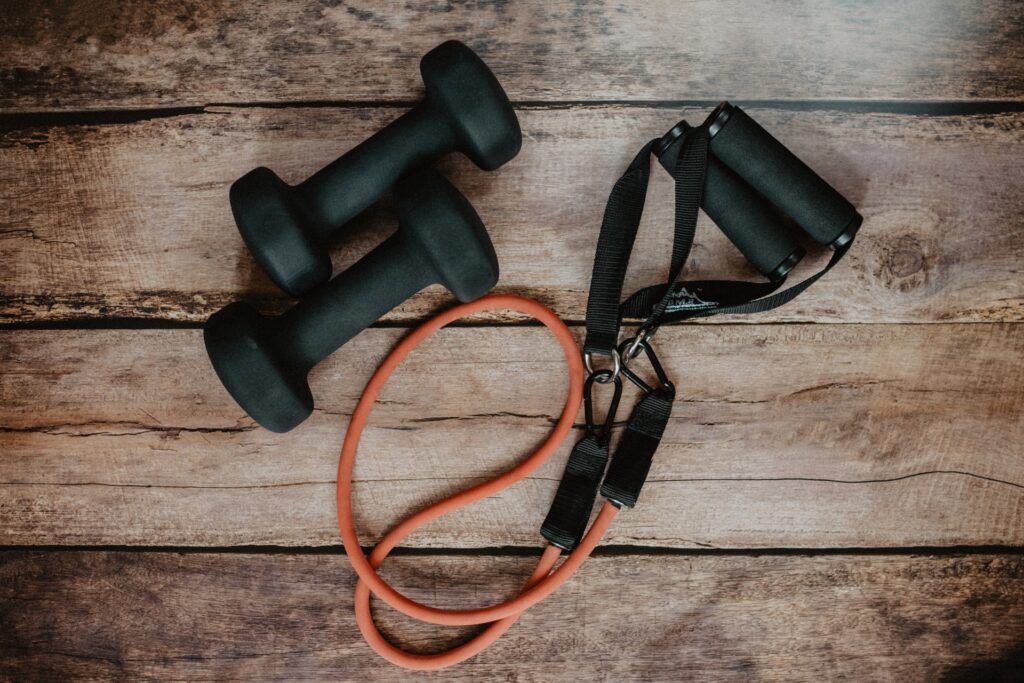 flatlay-of-two-dumbbells-and-exercise-band